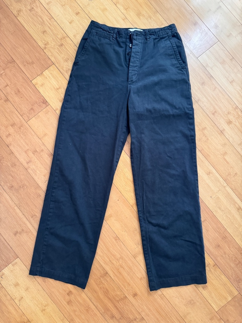 BUCK MASON, 27, navy blue pants